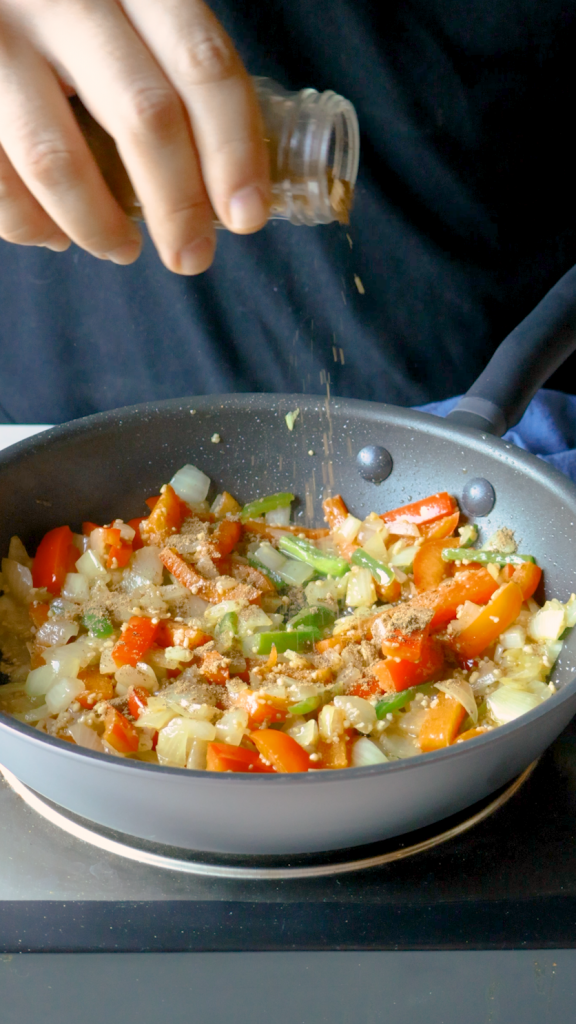 Add ginger and garlic and cook until fragrant, then stir in garam masala, cumin, turmeric and salt.